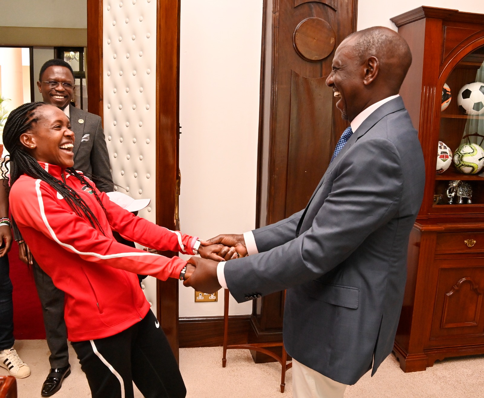 President Ruto Gifts Faith Kipyegon